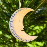 Small Golden Man on the Moon board decoration by East End Press