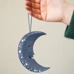 Small Midnight Man on the Moon board decoration by East End Press