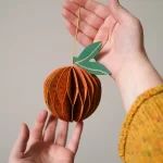 Orange Honeycomb ornament by East End Press